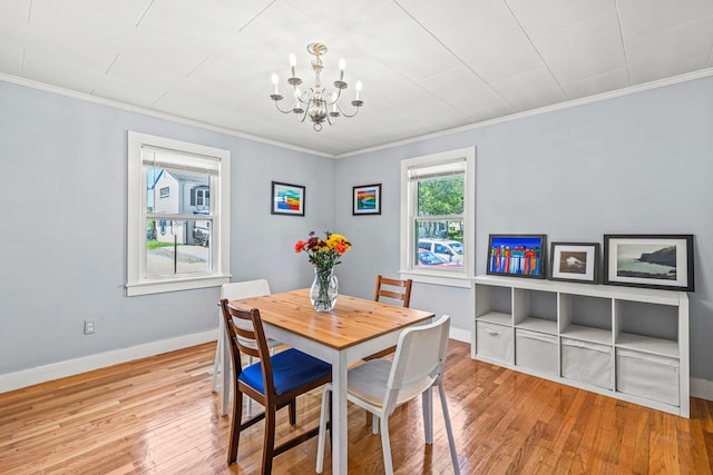 4 Hillside Ave, Biddeford, ME 04005 - dining room featuring a chandelier, ornamental molding, hardwood / wood-style floors, and baseboards