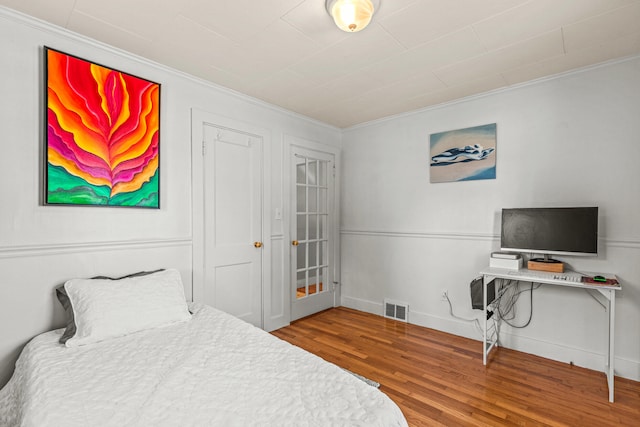 4 Hillside Ave, Biddeford, ME 04005 - bedroom featuring ornamental molding, wood finished floors, and baseboards