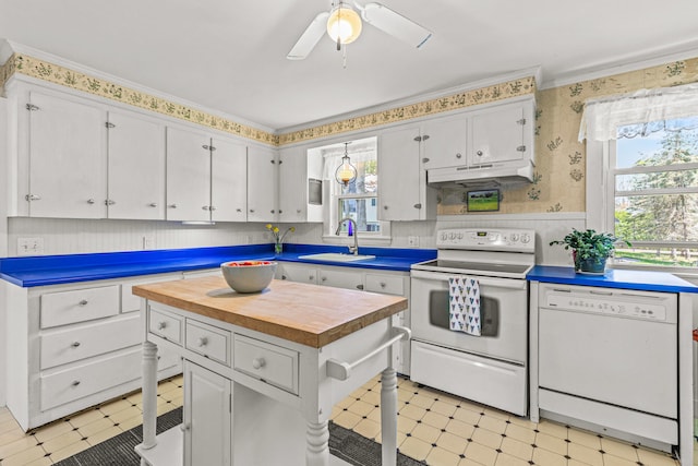 4 Hillside Ave, Biddeford, ME 04005 - kitchen with white appliances, a sink, under cabinet range hood, wallpapered walls, and wooden counters