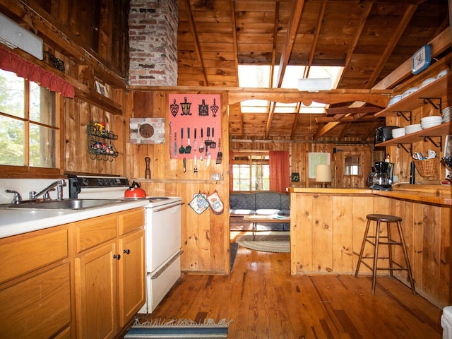 44 Cove Ln, Damariscotta, ME 04543 - kitchen featuring white range with electric stovetop, wood walls, wood finished floors, wood ceiling with exposed beams, and open shelves
