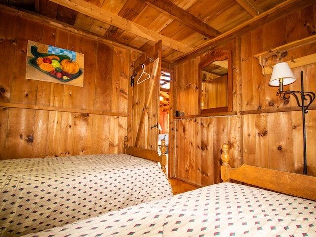 44 Cove Ln, Damariscotta, ME 04543 - unfurnished bedroom featuring wood walls and wooden ceiling with exposed beams