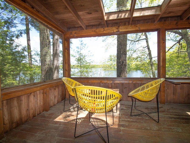 44 Cove Ln, Damariscotta, ME 04543 - sunroom featuring wooden walls, wood ceiling with exposed beams, hardwood / wood-style flooring, plenty of natural light, and a water view