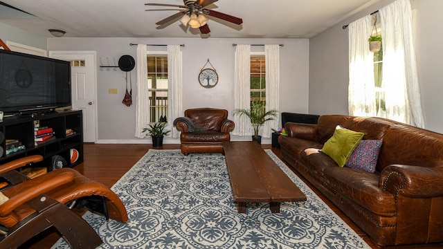 93 Maple St, Fryeburg, ME 04037 - living area with a ceiling fan, wood finished floors, and baseboards