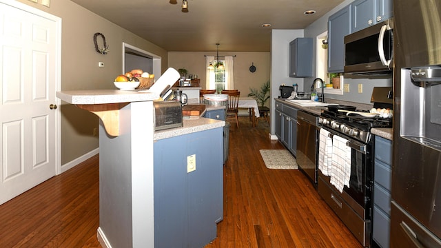 93 Maple St, Fryeburg, ME 04037 - kitchen featuring appliances with stainless steel finishes, a sink, light countertops, and dark wood finished floors