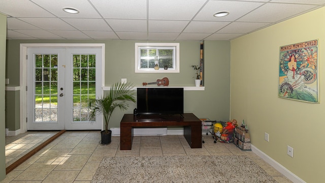 93 Maple St, Fryeburg, ME 04037 - doorway to outside featuring french doors, a paneled ceiling, tile patterned flooring, and baseboards