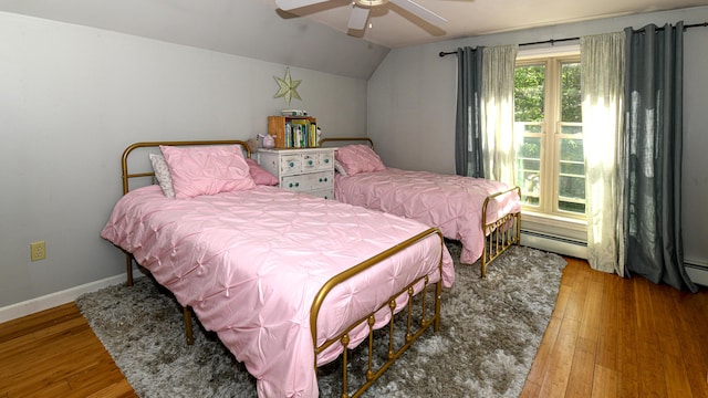 93 Maple St, Fryeburg, ME 04037 - bedroom with baseboard heating, lofted ceiling, wood finished floors, baseboards, and a ceiling fan
