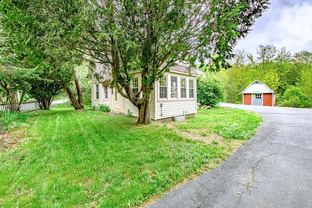 41 Bolton Hill Rd, Augusta, ME 04330 - view of green lawn featuring a garage and an outdoor structure
