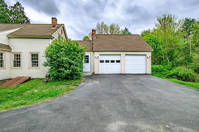 41 Bolton Hill Rd, Augusta, ME 04330 - view of front of house with an attached garage, a chimney, driveway, and a shingled roof
