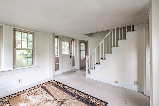 41 Bolton Hill Rd, Augusta, ME 04330 - foyer featuring stairs, wood finished floors, and baseboards