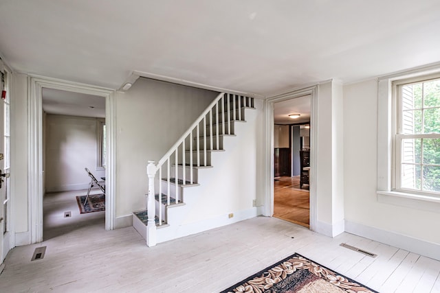 41 Bolton Hill Rd, Augusta, ME 04330 - foyer entrance featuring light wood finished floors, stairway, and baseboards