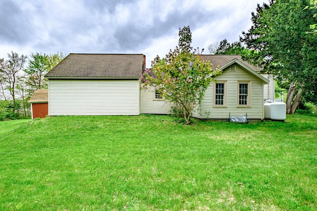 41 Bolton Hill Rd, Augusta, ME 04330 - rear view of property featuring a lawn and a shingled roof
