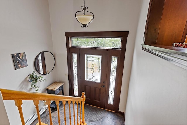 25 Parmenter Ter, China, ME 04358 - tiled foyer entrance with a baseboard heating unit, baseboards, and stairway