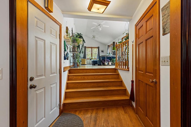 25 Parmenter Ter, China, ME 04358 - entryway with wood finished floors, stairway, ceiling fan, vaulted ceiling, and baseboards