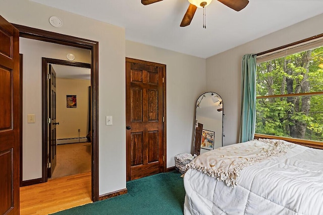 25 Parmenter Ter, China, ME 04358 - bedroom featuring baseboard heating, light colored carpet, ceiling fan, and baseboards