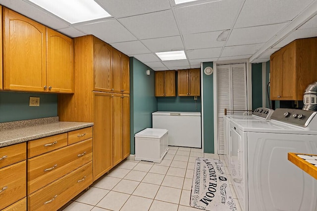 25 Parmenter Ter, China, ME 04358 - laundry room featuring cabinet space, washing machine and dryer, and light tile patterned floors