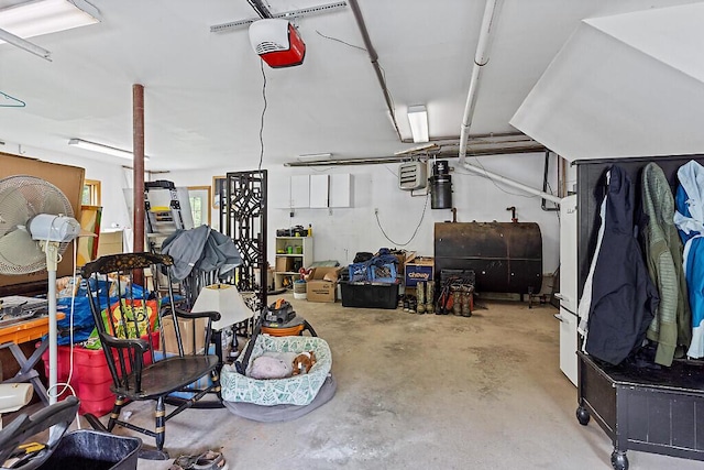 25 Parmenter Ter, China, ME 04358 - garage featuring oil tank and a garage door opener