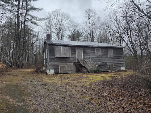 12 Middle Jam Rd, Gorham, ME 04038 - view of front facade featuring a chimney and stairway