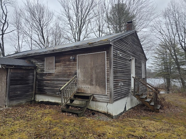 12 Middle Jam Rd, Gorham, ME 04038 - view of side of property featuring entry steps and a chimney