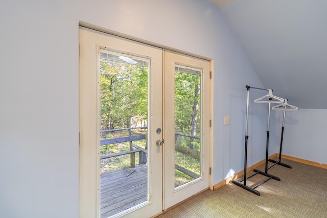 57 Sunset Rd, Dedham, ME 04429 - doorway with vaulted ceiling, baseboards, and carpet