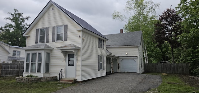 18 Pine St, Skowhegan, ME 04976 - view of front of house with entry steps, driveway, a garage, and metal roof