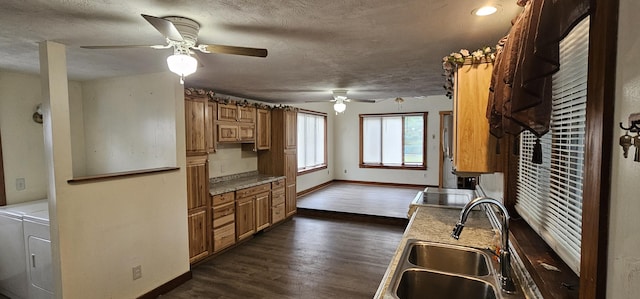 18 Pine St, Skowhegan, ME 04976 - kitchen featuring independent washer and dryer, a sink, a ceiling fan, baseboards, and dark wood-style floors