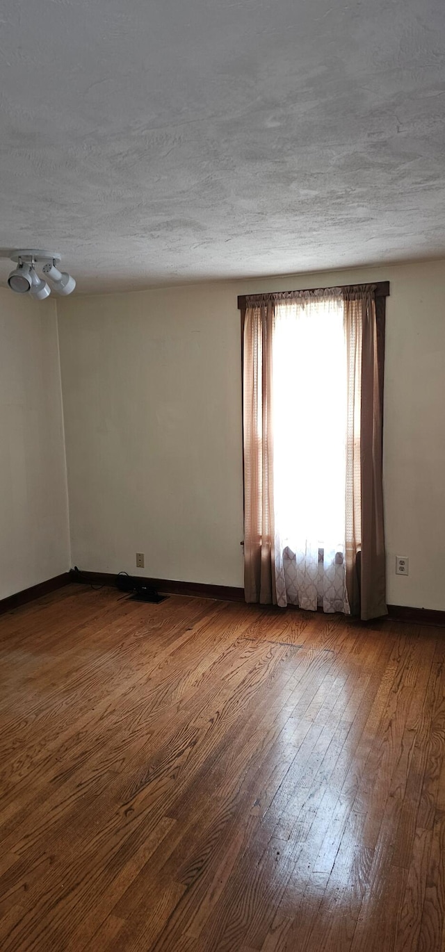 18 Pine St, Skowhegan, ME 04976 - empty room featuring wood-type flooring and baseboards
