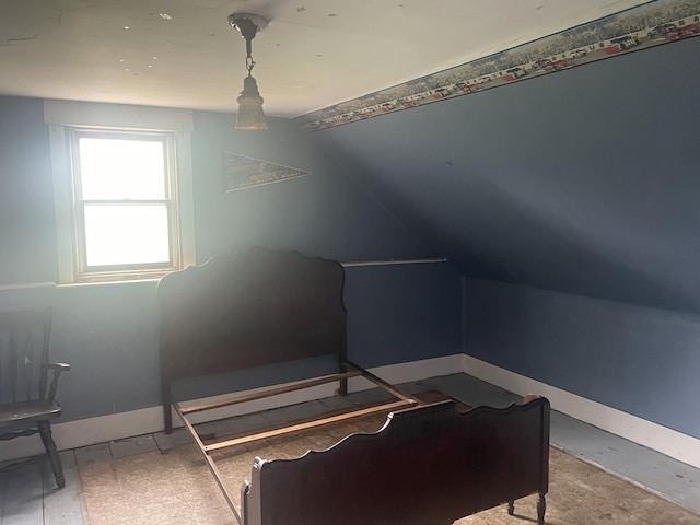 722 Farmington Rd, Strong, ME 04983 - bedroom with lofted ceiling and baseboards