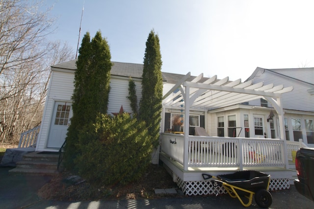 1414 State St, Veazie, ME 04401 - back of property featuring a wooden deck and a pergola
