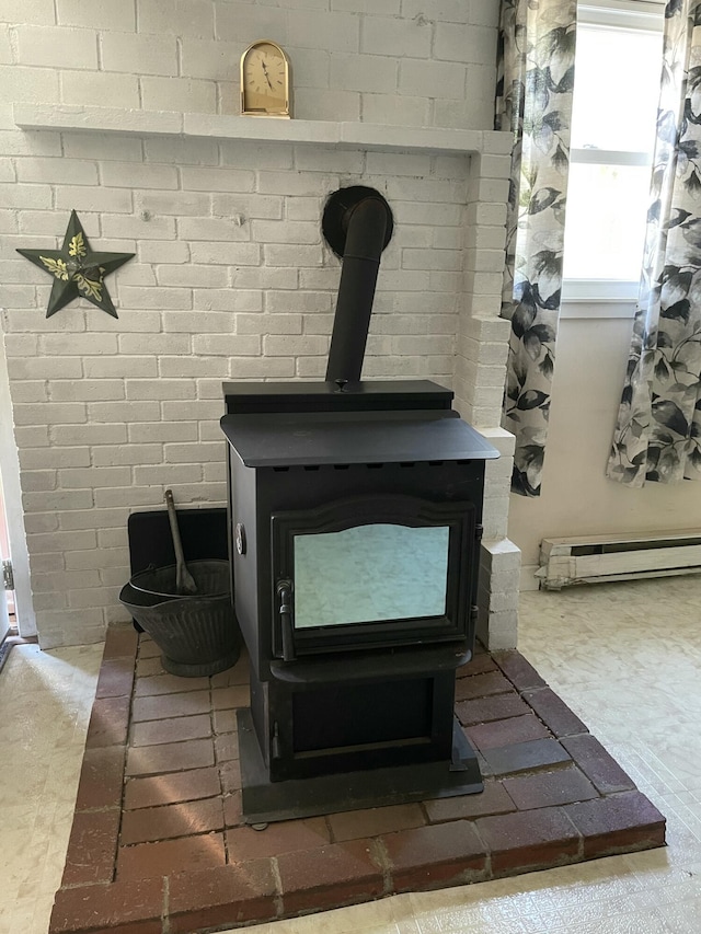 2130 Summerhaven Rd, Sidney, ME 04330 - detailed view of a wood stove and a baseboard heating unit