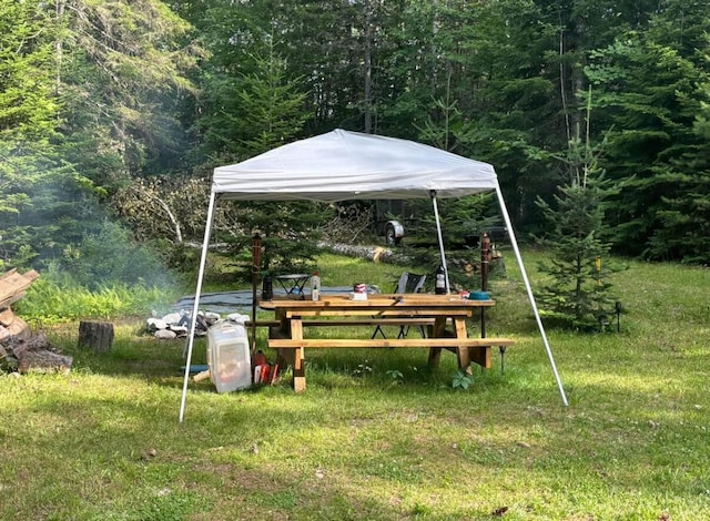 172 Blanchard Rd, Monson, ME 04464 - view of green lawn featuring a forest view