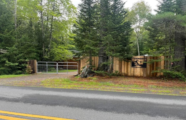 172 Blanchard Rd, Monson, ME 04464 - view of asphalt road with a gate