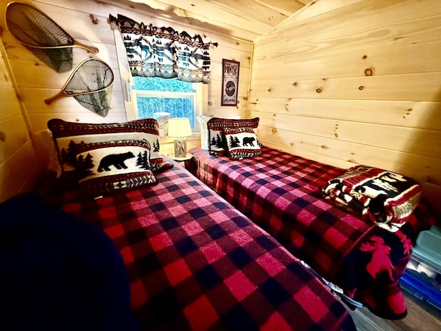 172 Blanchard Rd, Monson, ME 04464 - bedroom featuring vaulted ceiling and wooden walls
