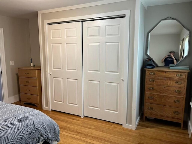 224 N St Unit 101-102, Saco, ME 04072 - bedroom featuring light wood-style flooring, a closet, and baseboards