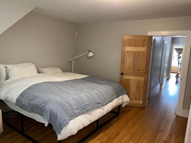 224 N St Unit 101-102, Saco, ME 04072 - bedroom with hardwood / wood-style flooring and radiator