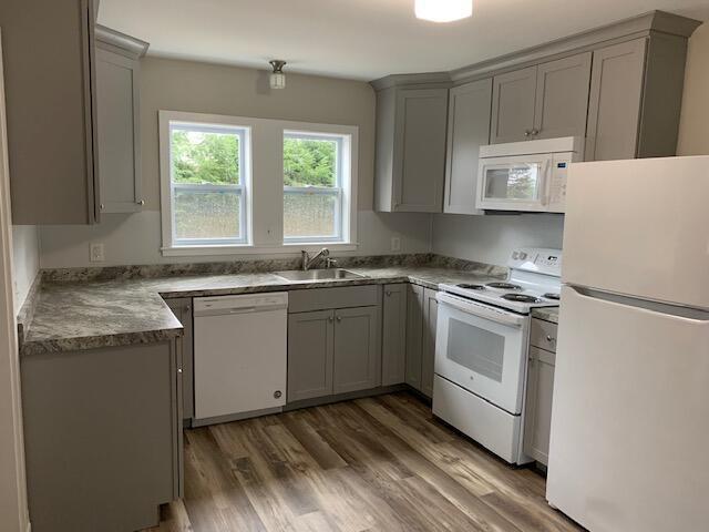 224 N St Unit 101-102, Saco, ME 04072 - kitchen featuring white appliances, gray cabinets, a sink, and wood finished floors
