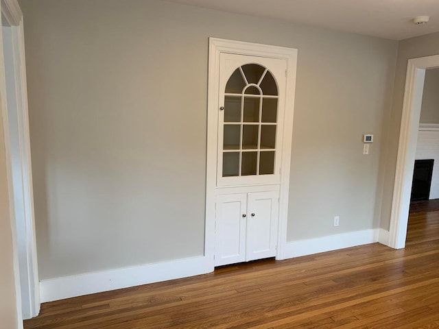 224 N St Unit 101-102, Saco, ME 04072 - empty room featuring wood finished floors, a smoke detector, and baseboards
