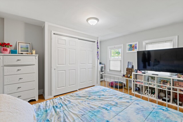 224 N St Unit 101-102, Saco, ME 04072 - bedroom with wood finished floors, a closet, and baseboards