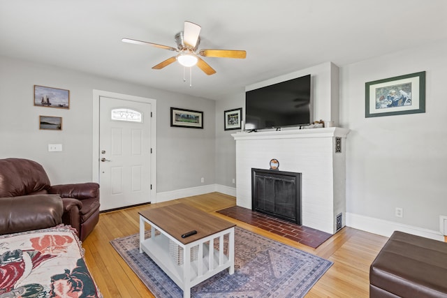 224 N St Unit 101-102, Saco, ME 04072 - living area with ceiling fan, a fireplace, wood finished floors, and baseboards