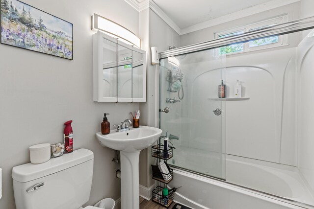 224 N St Unit 101-102, Saco, ME 04072 - full bathroom featuring toilet, bath / shower combo with glass door, ornamental molding, and a sink
