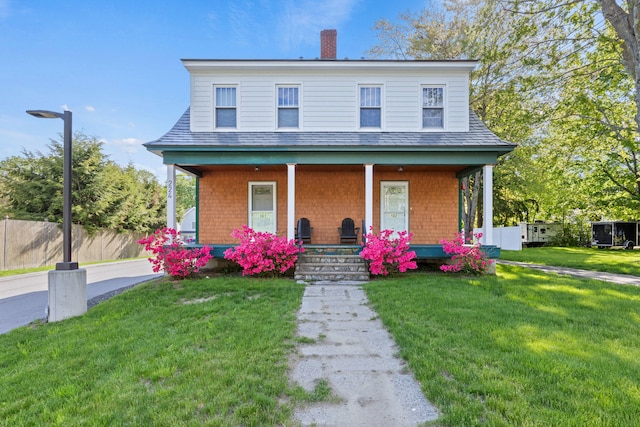 224 N St Unit 101-102, Saco, ME 04072 - view of front of house featuring a porch and a chimney