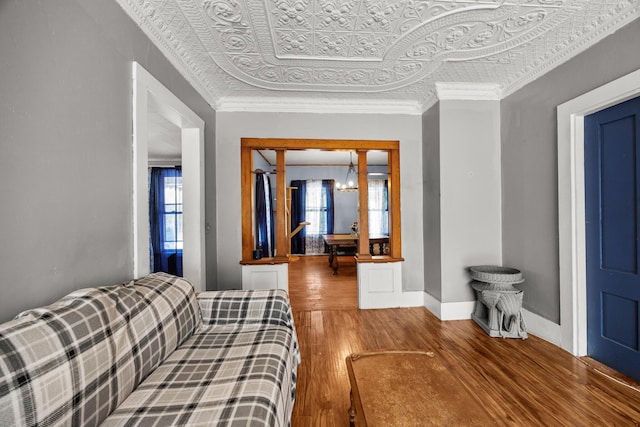 43 Whales Back Rd, Sullivan, ME 04664 - bedroom with an ornate ceiling, wood finished floors, baseboards, and a chandelier