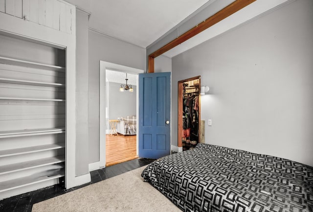 43 Whales Back Rd, Sullivan, ME 04664 - bedroom with a chandelier, dark wood-style floors, and a closet