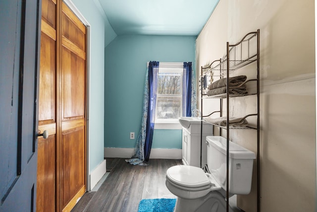 43 Whales Back Rd, Sullivan, ME 04664 - bathroom featuring toilet, wood finished floors, and baseboards