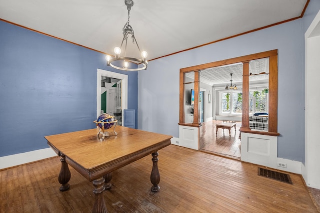 43 Whales Back Rd, Sullivan, ME 04664 - dining space with a chandelier, ornamental molding, hardwood / wood-style floors, and baseboards