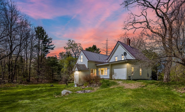 43 Whales Back Rd, Sullivan, ME 04664 - view of front of house featuring a front yard, a chimney, and metal roof