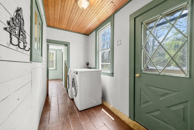 43 Whales Back Rd, Sullivan, ME 04664 - laundry area with wood ceiling, healthy amount of natural light, separate washer and dryer, dark wood finished floors, and wood walls