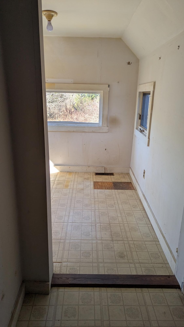 19 Lubec Rd, Whiting, ME 04691 - spare room with vaulted ceiling and tile patterned floors