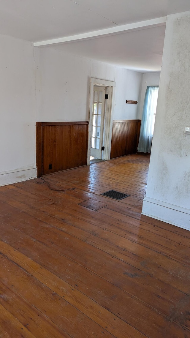19 Lubec Rd, Whiting, ME 04691 - empty room featuring plenty of natural light, wainscoting, and hardwood / wood-style flooring
