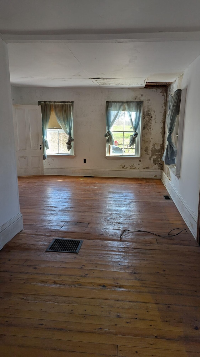 19 Lubec Rd, Whiting, ME 04691 - empty room featuring plenty of natural light, hardwood / wood-style flooring, and baseboards
