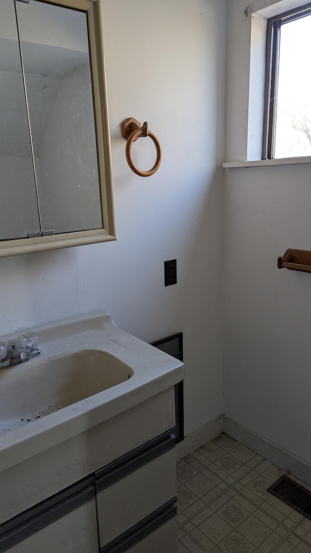 19 Lubec Rd, Whiting, ME 04691 - bathroom featuring vanity, tile patterned floors, and baseboards
